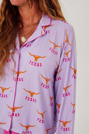 Texas Longhorn Lounger Game day Pajamas with vibrant Texas Longhorn design on a lavender background.