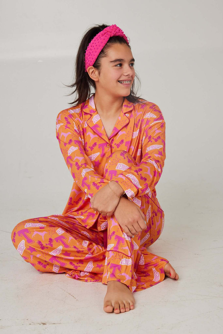 Girl wearing Tennessee Tranquility Time Gameday Pajamas in vibrant colors, showcasing comfort and style.