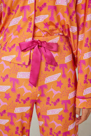 Tennessee Tranquility Time Gameday Pajamas featuring vibrant orange and pink design with a bow tie.