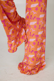Tennessee Tranquility Time Gameday Pajamas featuring vibrant orange fabric with Tennessee logos and stars.