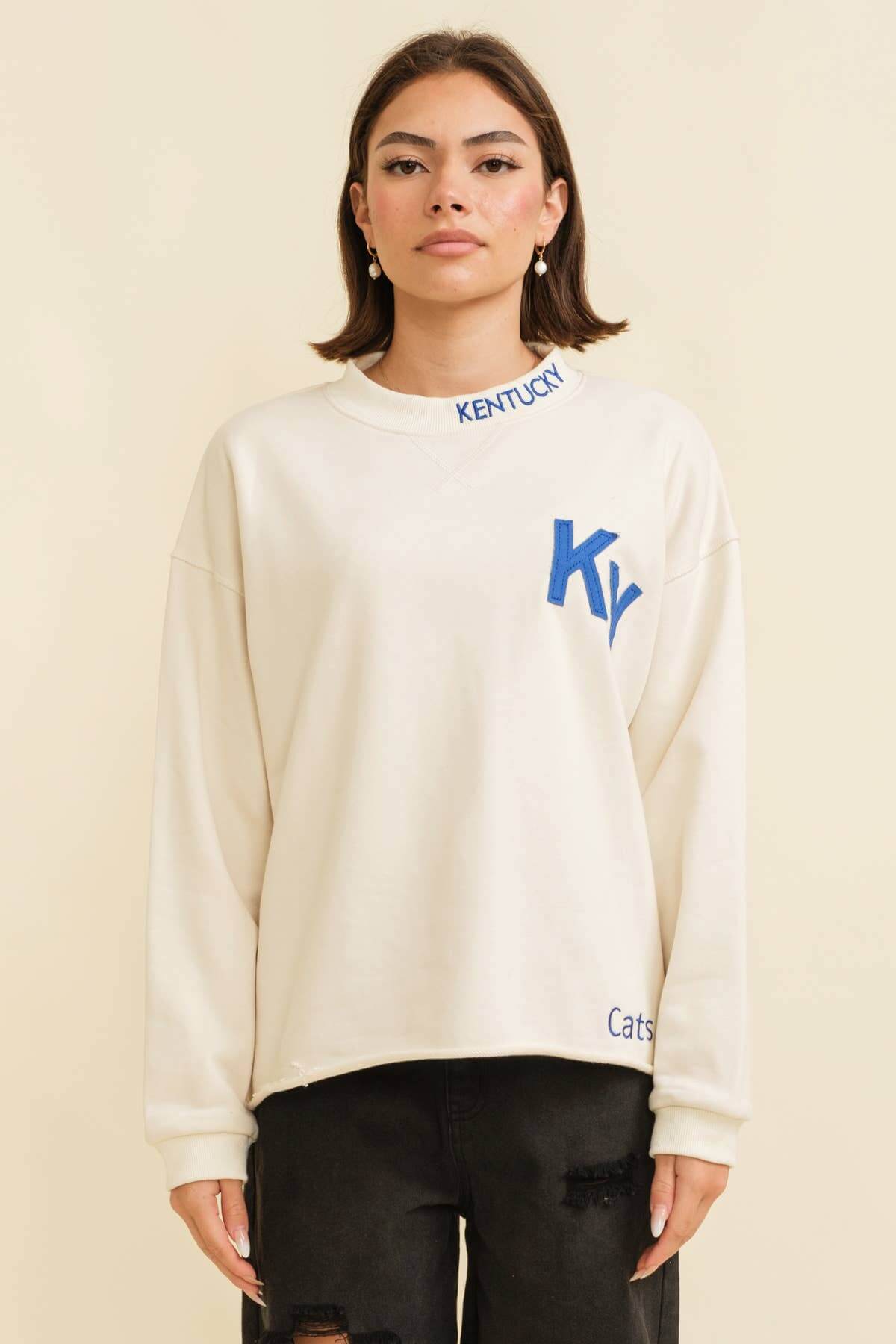 Lightweight Kentucky pullover sweater with embroidered logo, perfect for supporting the Cats in style this spring.